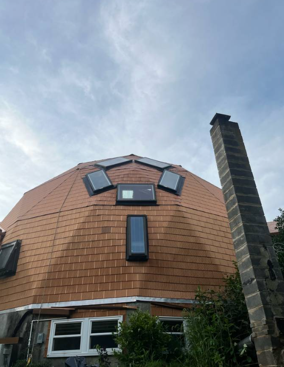 Cedar-tone shingle roof installed on a geodesic dome home